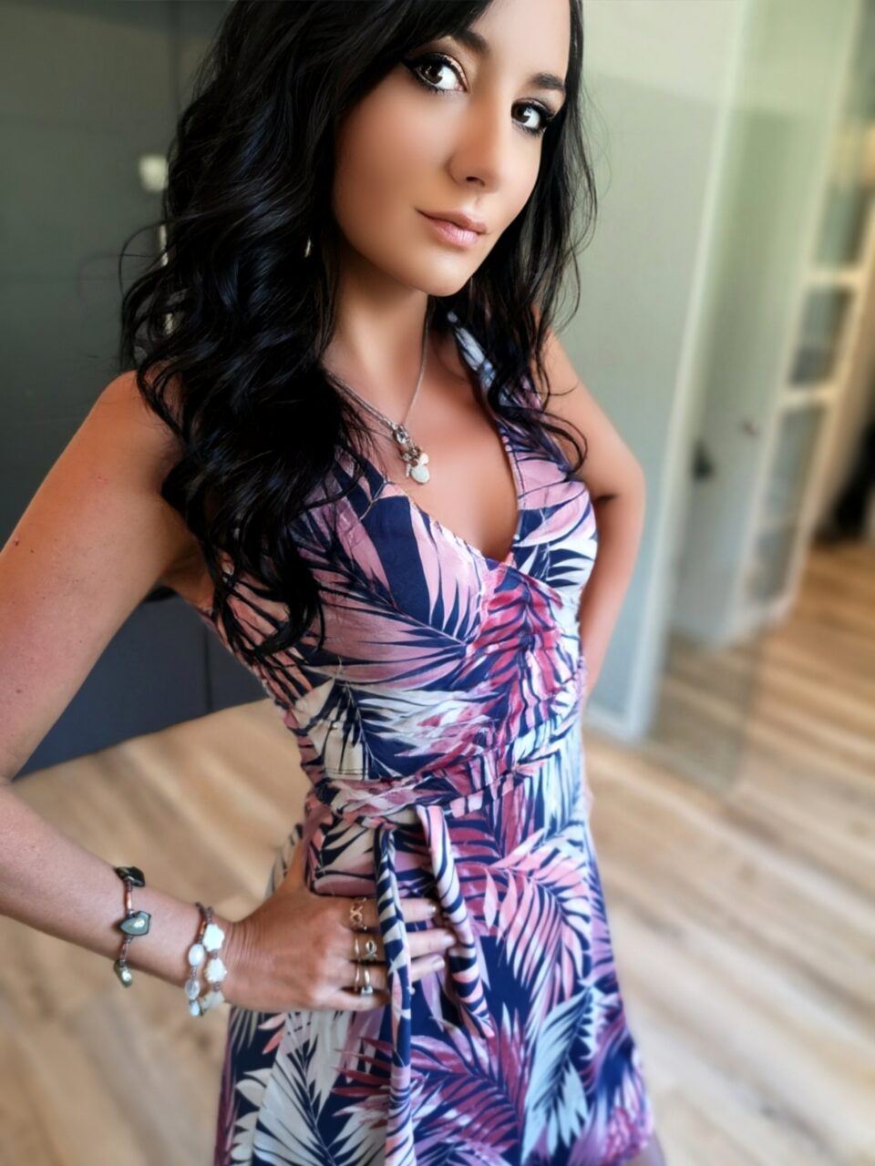 Mauve and white on navy tropical print half-wrap dress.