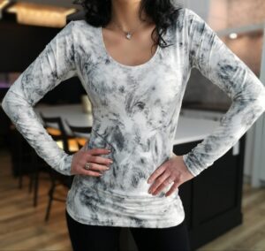 Long-sleeve white gray top.