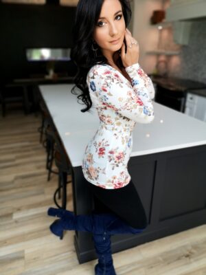 Ivory floral print long-sleeve top.