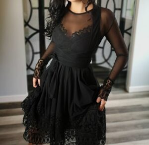 Black mesh crop wrap jacket with lace sleeves.