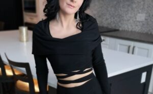 Black hooded long-sleeve crop top.