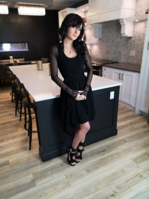 Tissue hem black mesh dress.