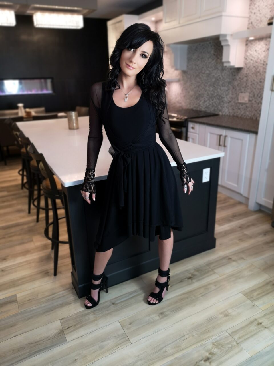 Tissue hem black mesh dress.