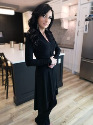 Long black cardigan, poly spandex blend.