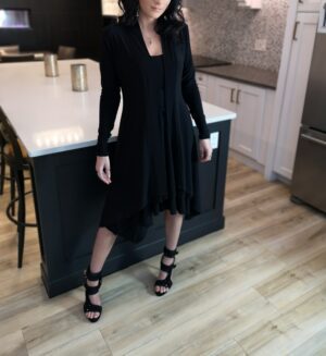 Long black cardigan, poly spandex blend.