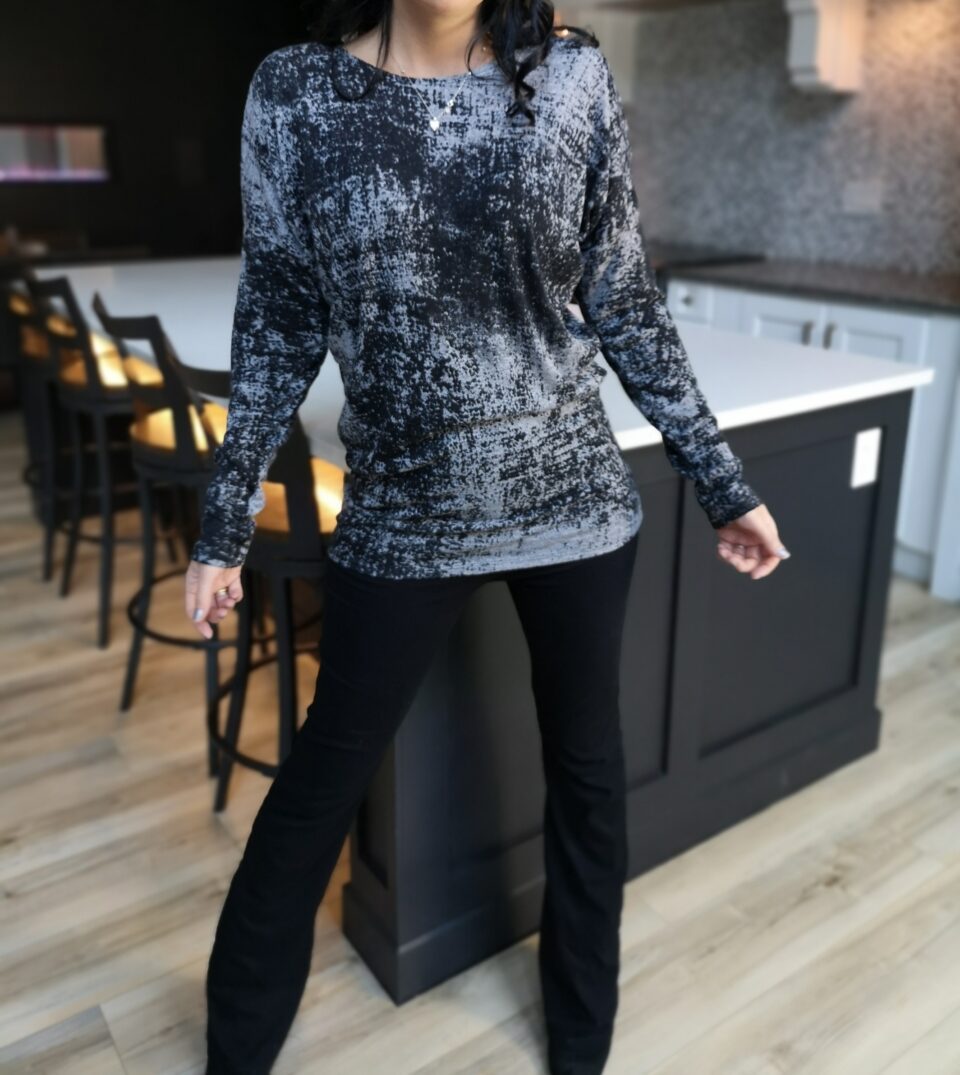 Draping speckled gray long-sleeve top.