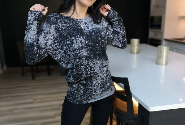 Draping speckled gray long-sleeve top.