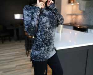 Draping speckled gray long-sleeve top.