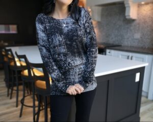 Draping speckled gray long-sleeve top.