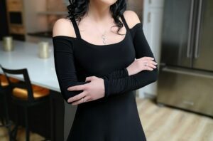 Cold shoulder long-sleeve black maxi dress.