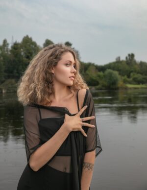 Black mesh swimsuit/dress jacket.