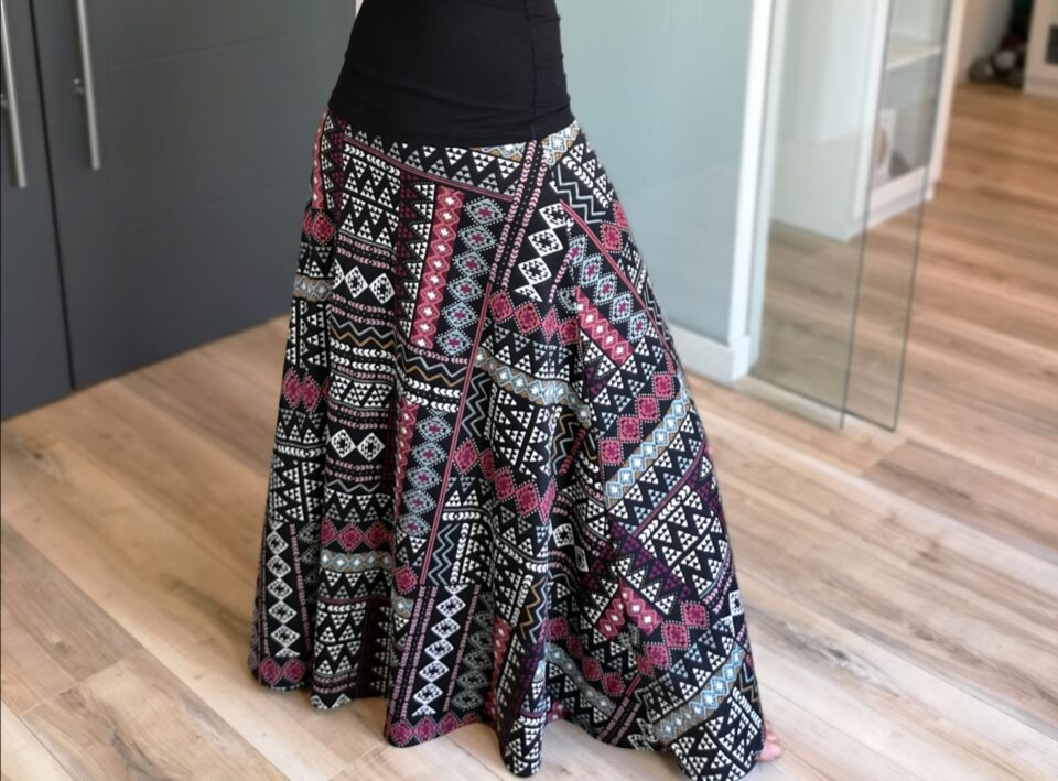 Red and white on black geometrical print floor length printed skirt.