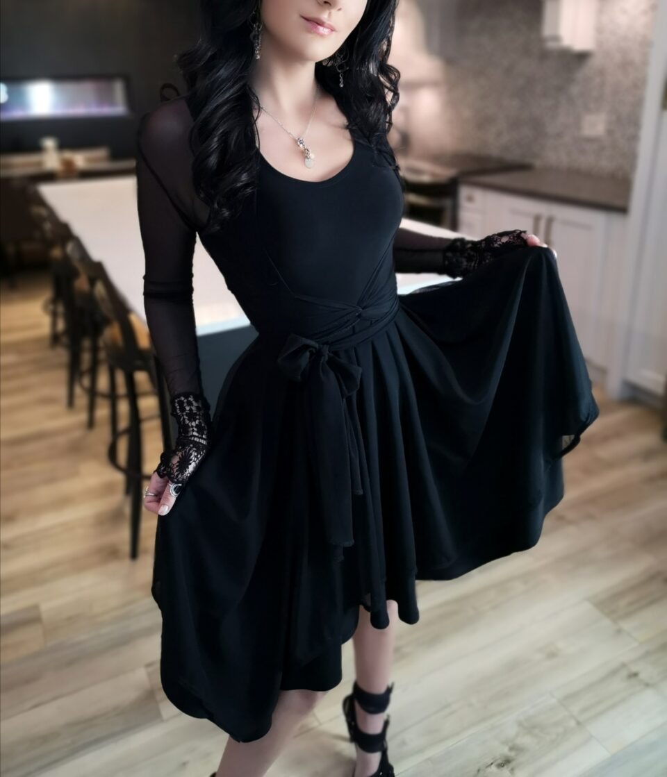 Tissue hem black mesh dress.