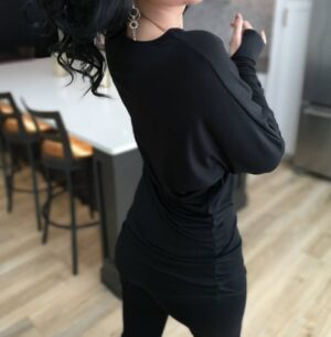 Black off-the-shoulder unsymmetrical draping tunic top.