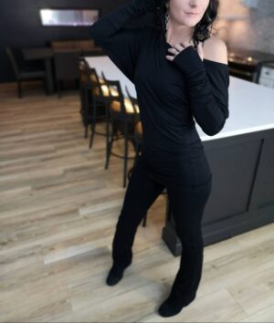 Black off-the-shoulder unsymmetrical draping tunic top.