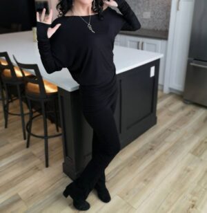 Black off-the-shoulder unsymmetrical draping tunic top.