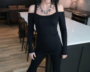 Exposed shoulder long sleeve black tunic top.