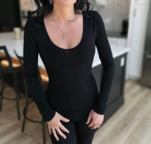 Soft fitted low-cut long sleeve black top.