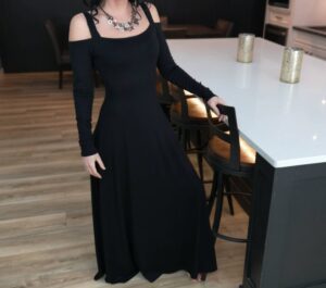 Exposed shoulder black maxi dress.