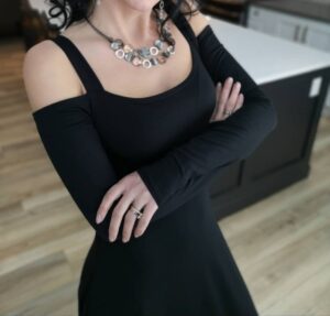 Exposed shoulder black maxi dress.
