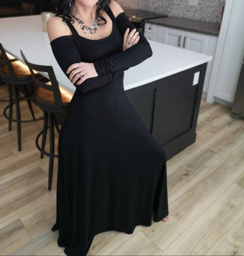 Exposed shoulder black maxi dress.