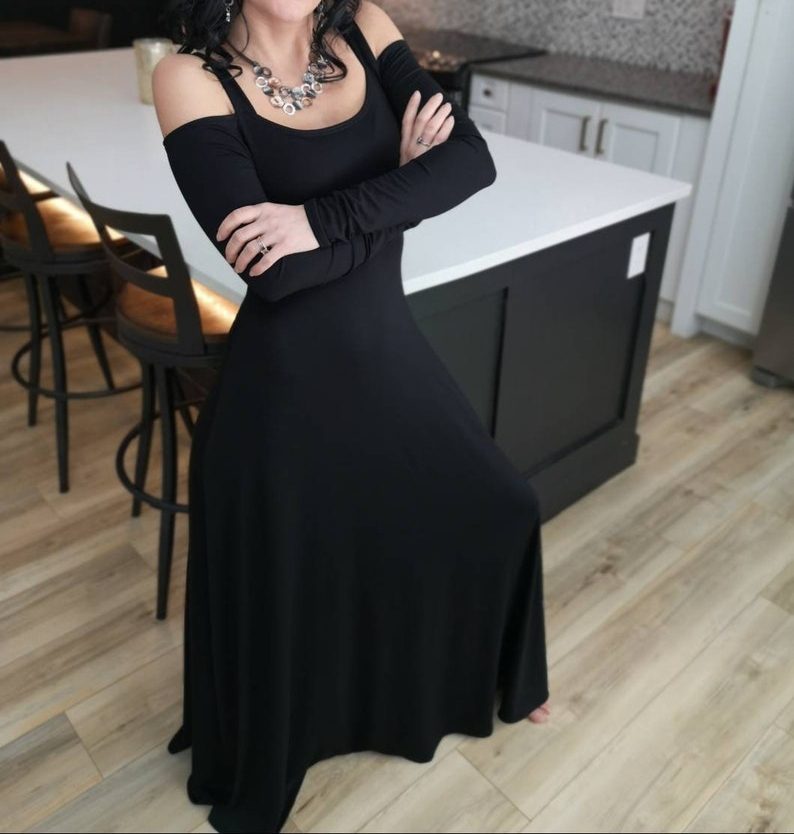 Exposed shoulder black long sleeve maxi dress.