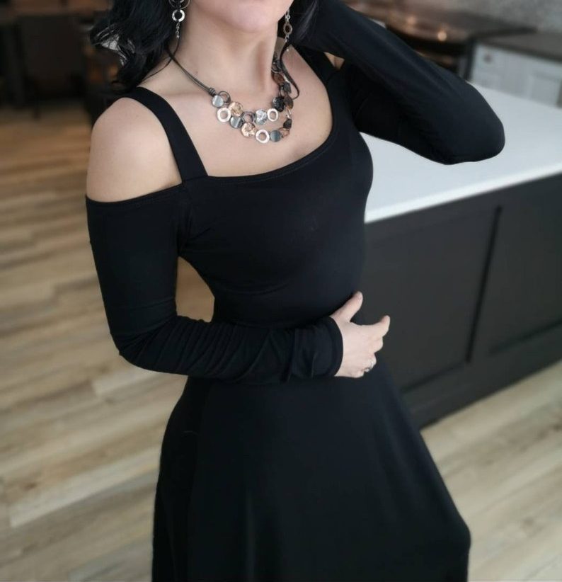 Exposed shoulder black maxi dress.