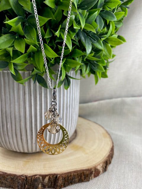 Dazzling gold circle charm.