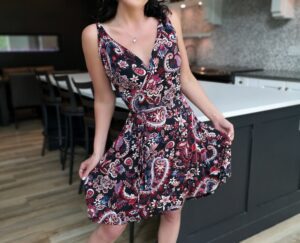 Red on black short paisley open back dress.