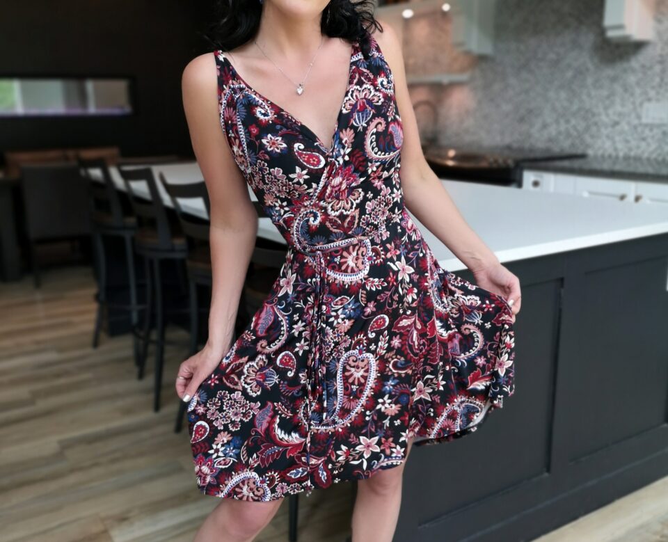 Red on black short paisley open back dress.