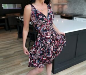 Red on black short paisley open back dress.