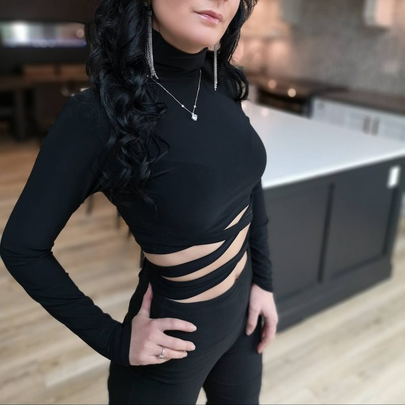 Black long-sleeve turtleneck crop top.
