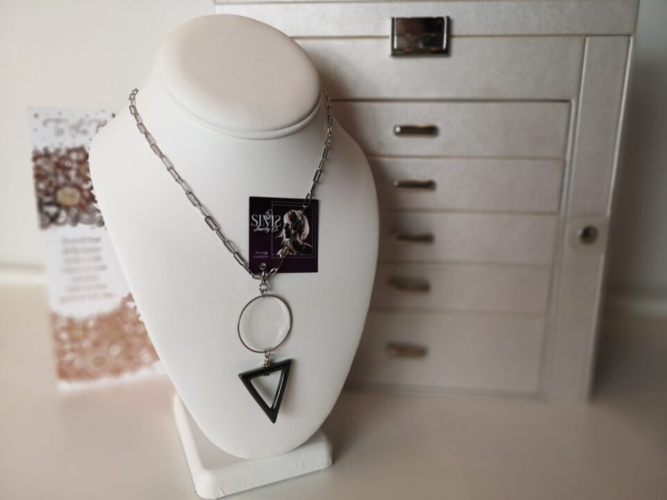 Black triangle pendant stone with a stunning circle.