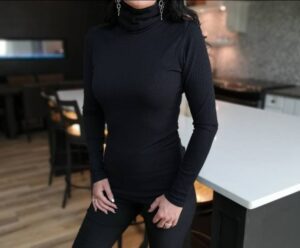 Black ribbed turtleneck fitted long-sleeve top.