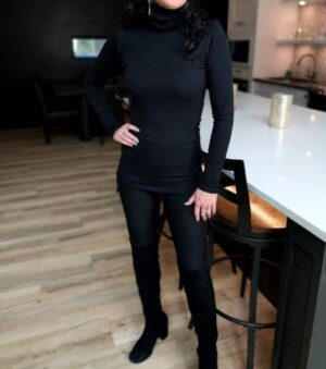 Black ribbed turtleneck fitted long-sleeve top.