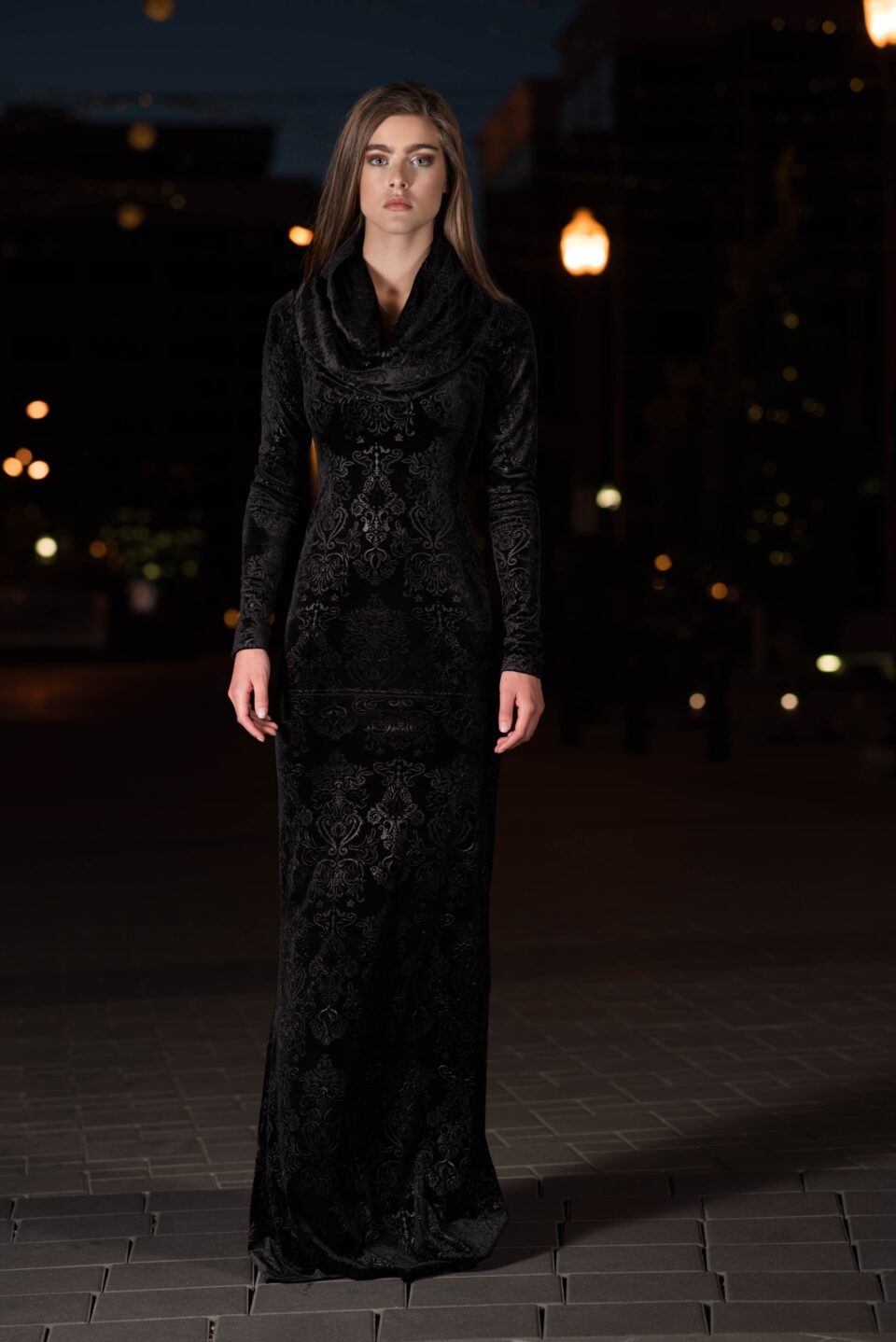 Black velvet hooded long-sleeve dress.