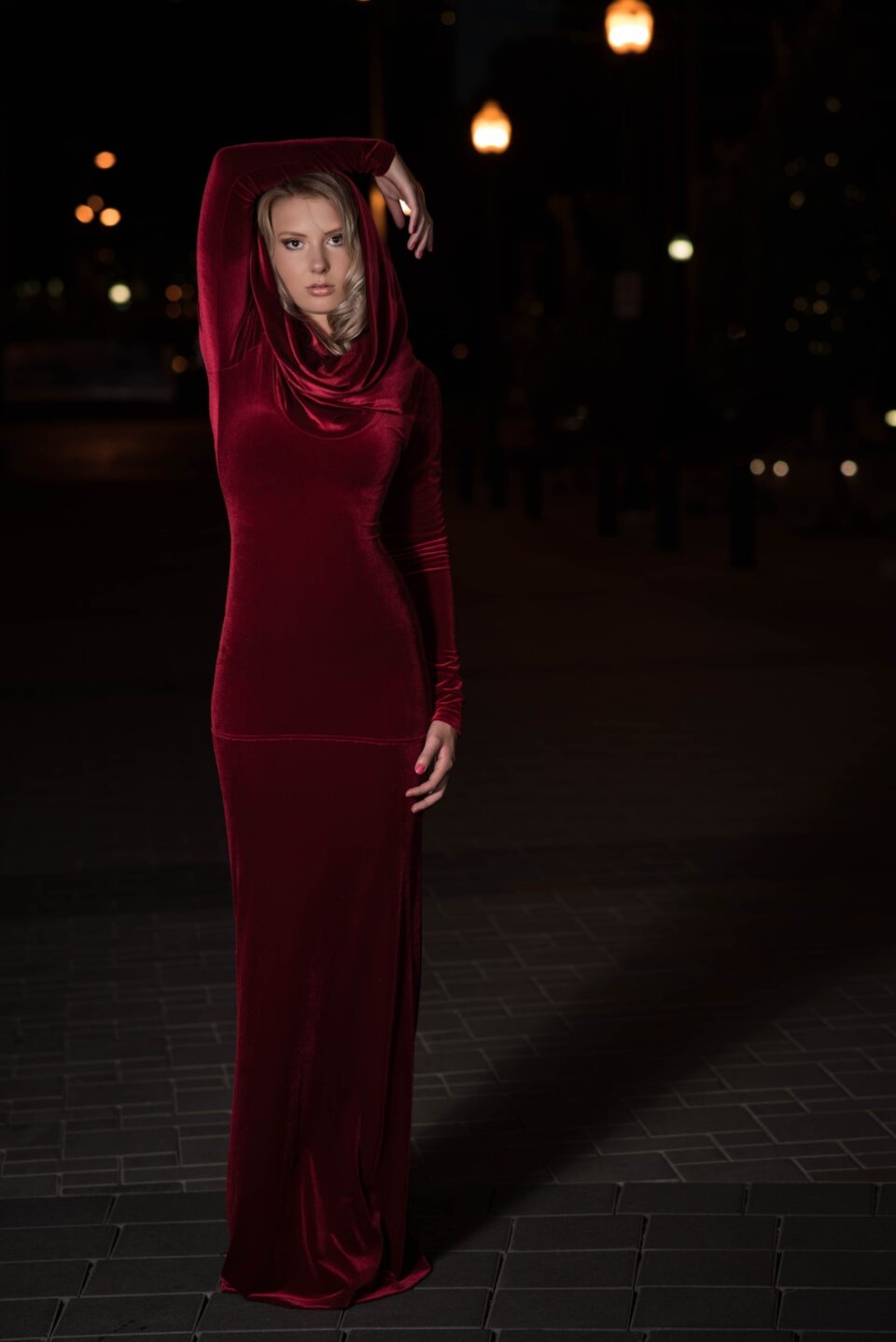 Red velvet hooded long-sleeve dress.