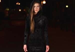Black velvet hooded long-sleeve dress.