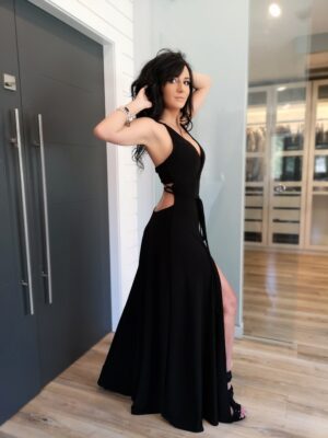 Black maxi dress with open back and front slit.