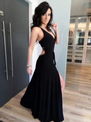 Black maxi dress with open back and front slit.