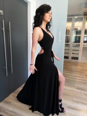 Black maxi dress with open back and front slit.