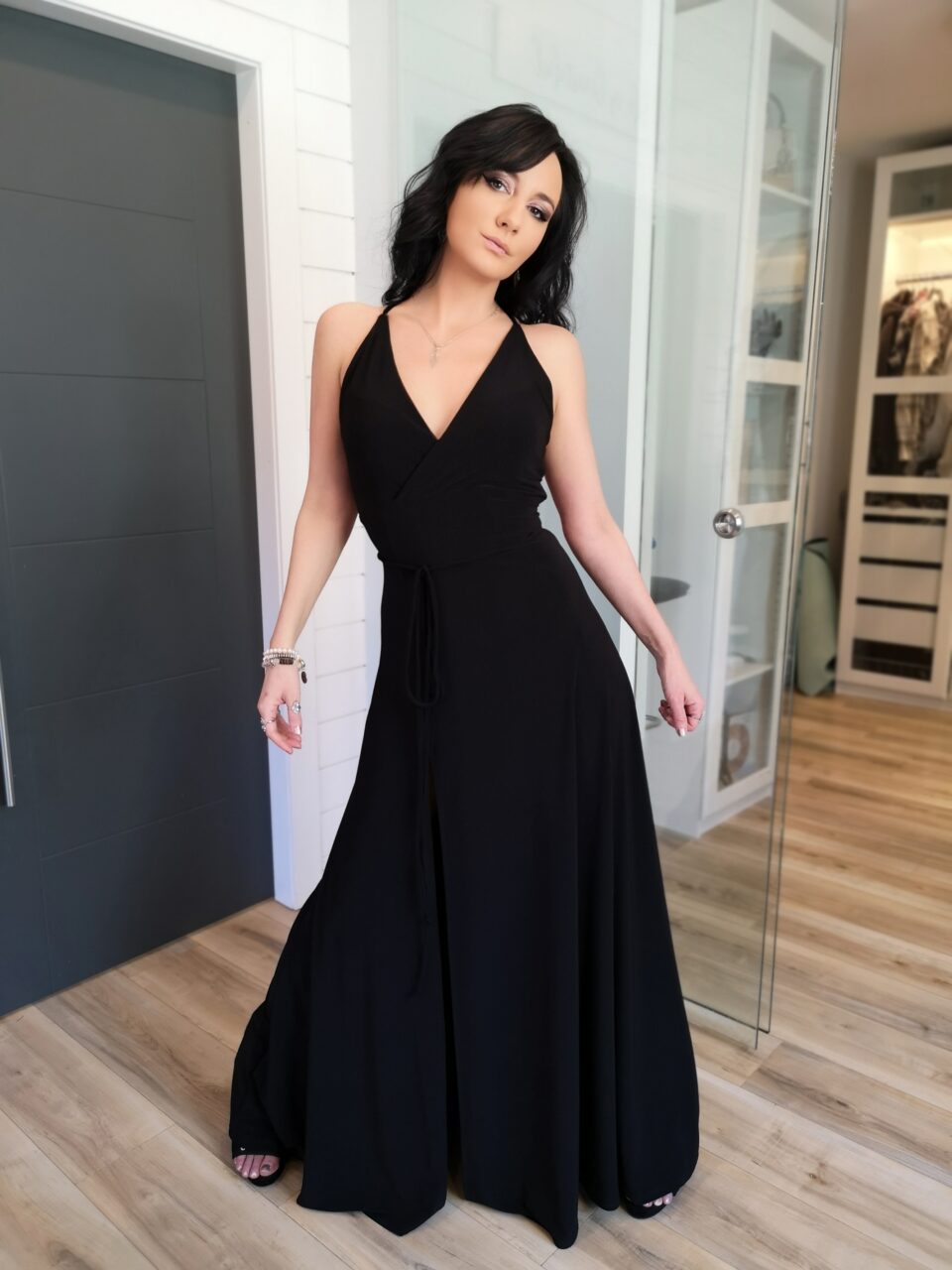 Black maxi dress with open back and front slit.