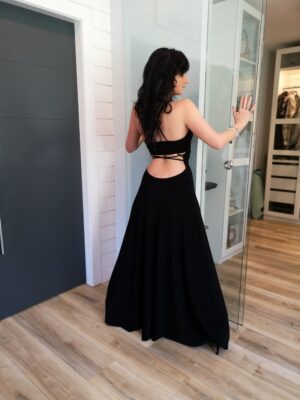 Black maxi dress with open back and front slit.