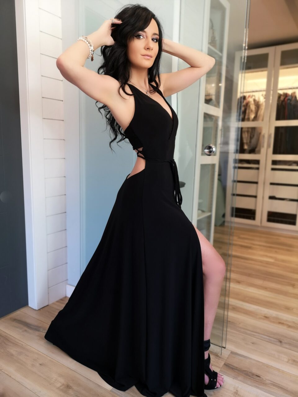 Black maxi dress with open back and front slit.
