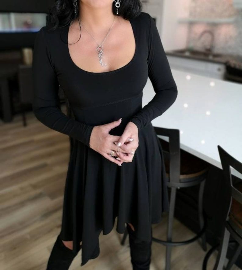 Black tissue hem asymmetrical long-sleeve dress.