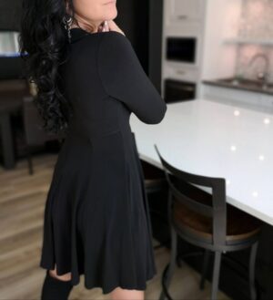 Black tissue hem asymmetrical long-sleeve dress.