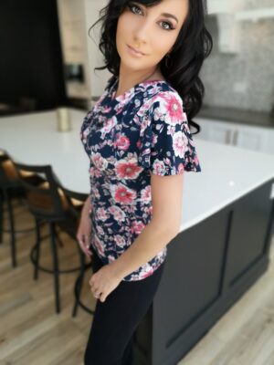 Pink on navy blue fitted floral print cowl neck top.
