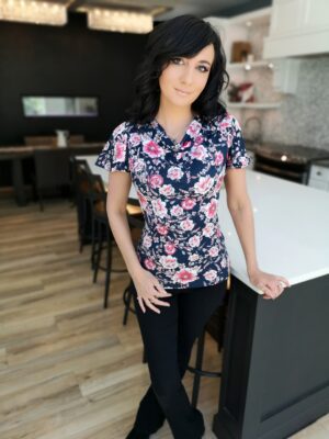 Pink on navy blue fitted floral print cowl neck top.