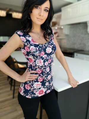 Pink on navy blue floral print fitted cap sleeve top.