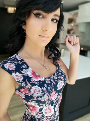 Pink on navy blue floral print fitted cap sleeve top.